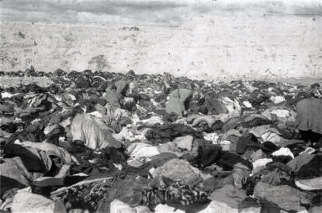 Babi-Yar  German soldiers search through the belongings of  murdered Jews in the ravine